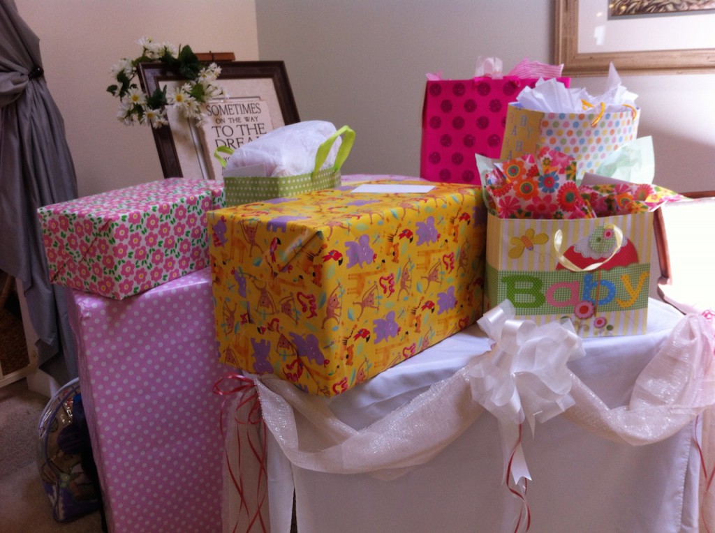 Gift table with Flower Garland for the Mom-to-Be to wear.